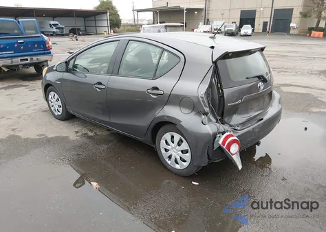 2014 Toyota Prius C One from USA, damaged, VIN JTDKDTB37E1559830